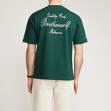 Brother Wolf Quality Goods Tee Bottle Green | Brotherwolf | Mad About The Boy